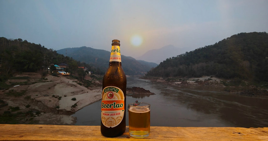 Enjoy Lao beer and watch the sunset